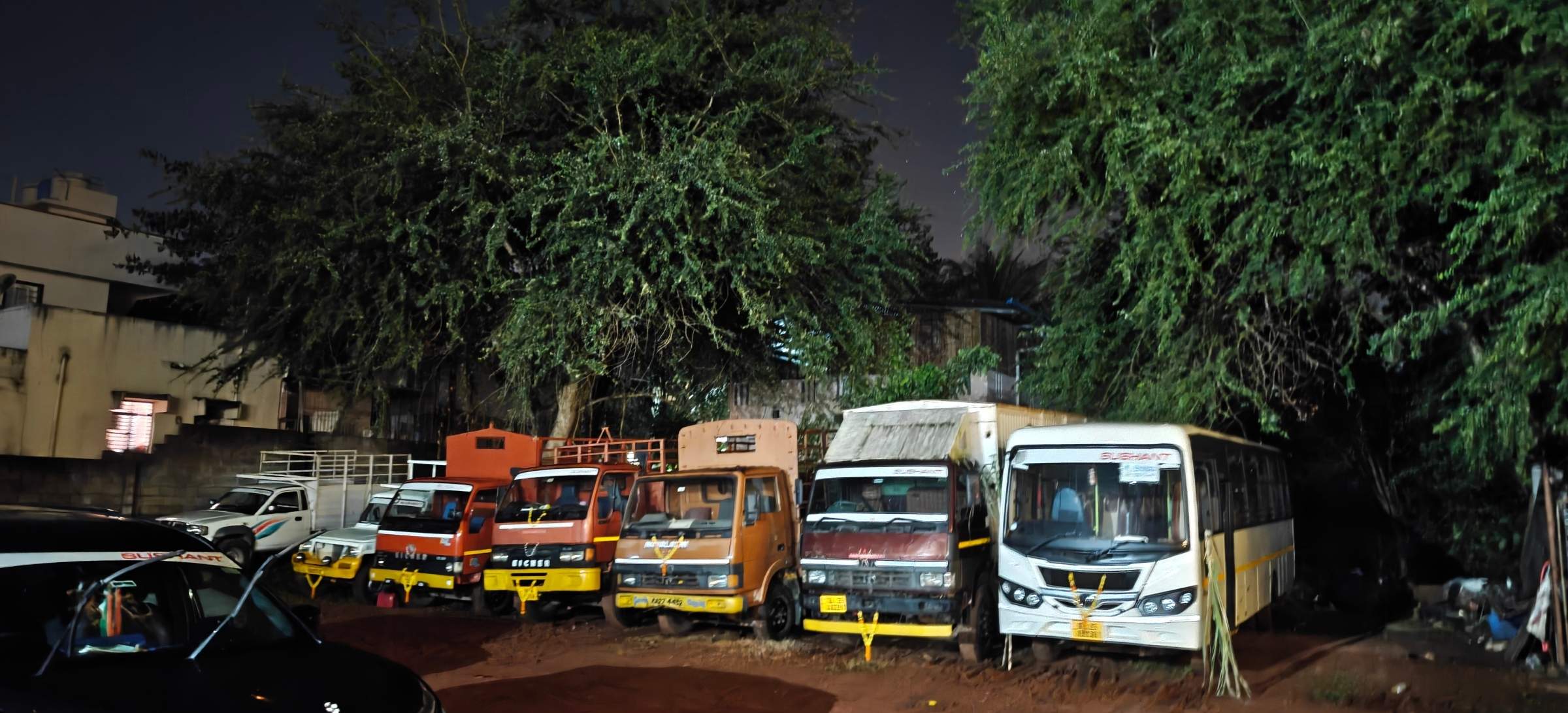 Trucks lined up in the yard at night